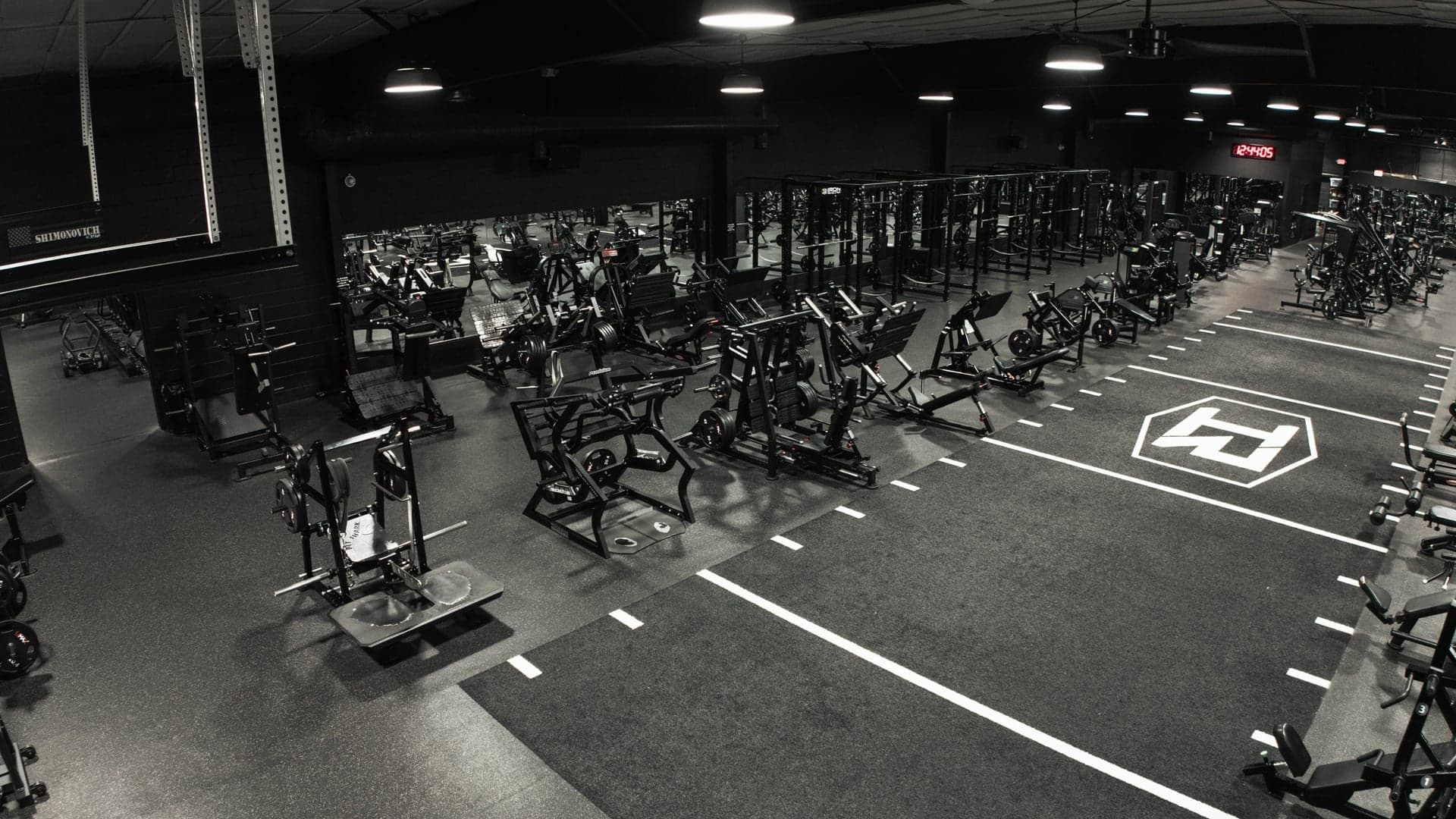 The Iron Revolution logo on the gym turf